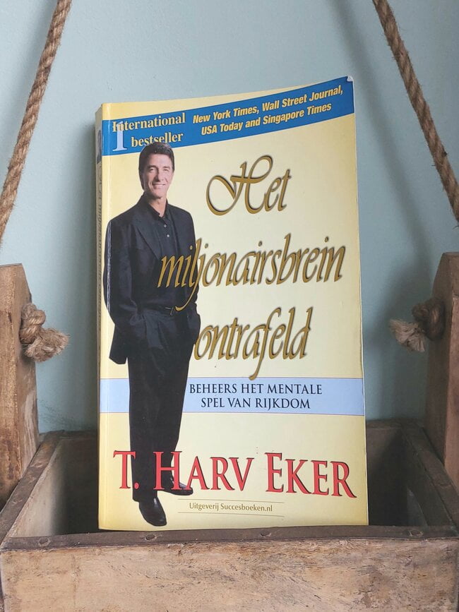 Op deze afbeelding zie je het boek Het Miljonairsbrein ontrafeld
